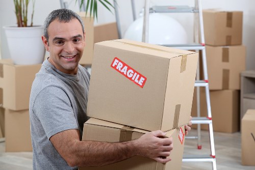 Preparation checklist and packed boxes for a home move in Ealing