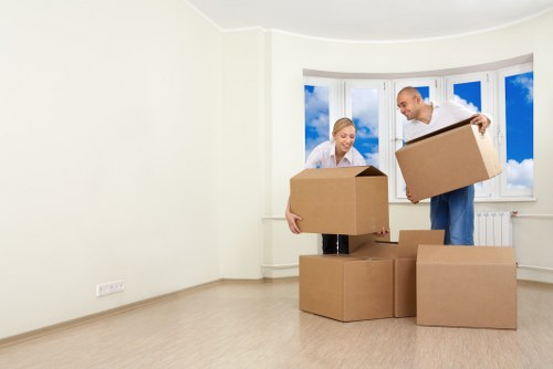 Professional movers loading a van for an Ealing relocation