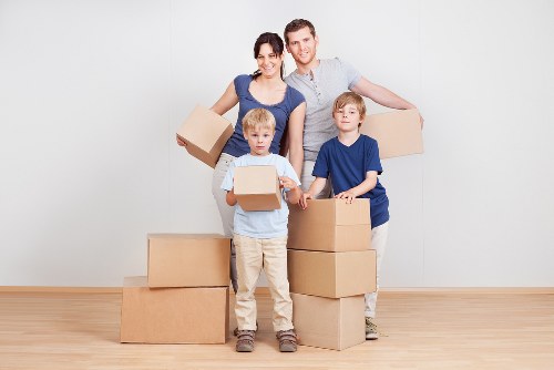 Removal van and moving team in Ealing street