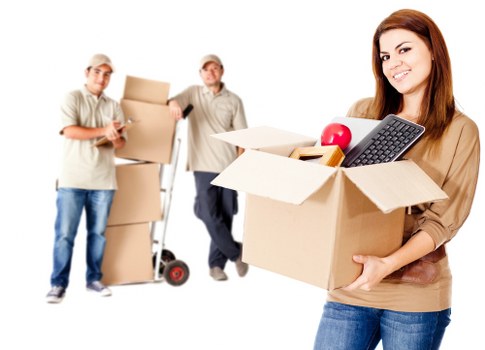 Local moving service loading furniture carefully for an Ealing house relocation