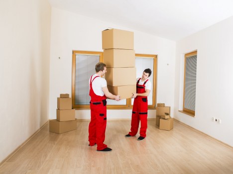 Local furniture pick-up service loading items from a residential property in Ealing